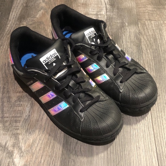 black adidas with holographic stripes